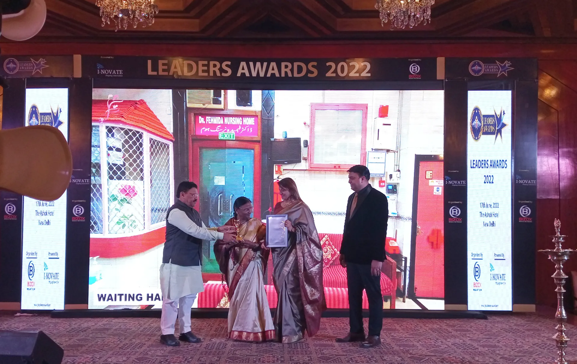 Dr. Fehmida Shaikh receiving framed certificate from eminent healthcare dignitaries