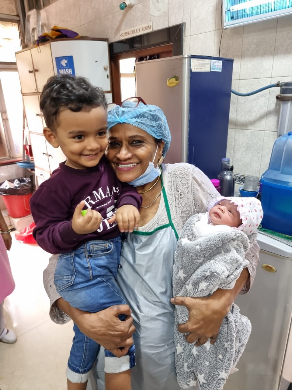 Dr. Fehmida Shaikh with mother, toddler and newborn baby at Fehmida Nursing Home